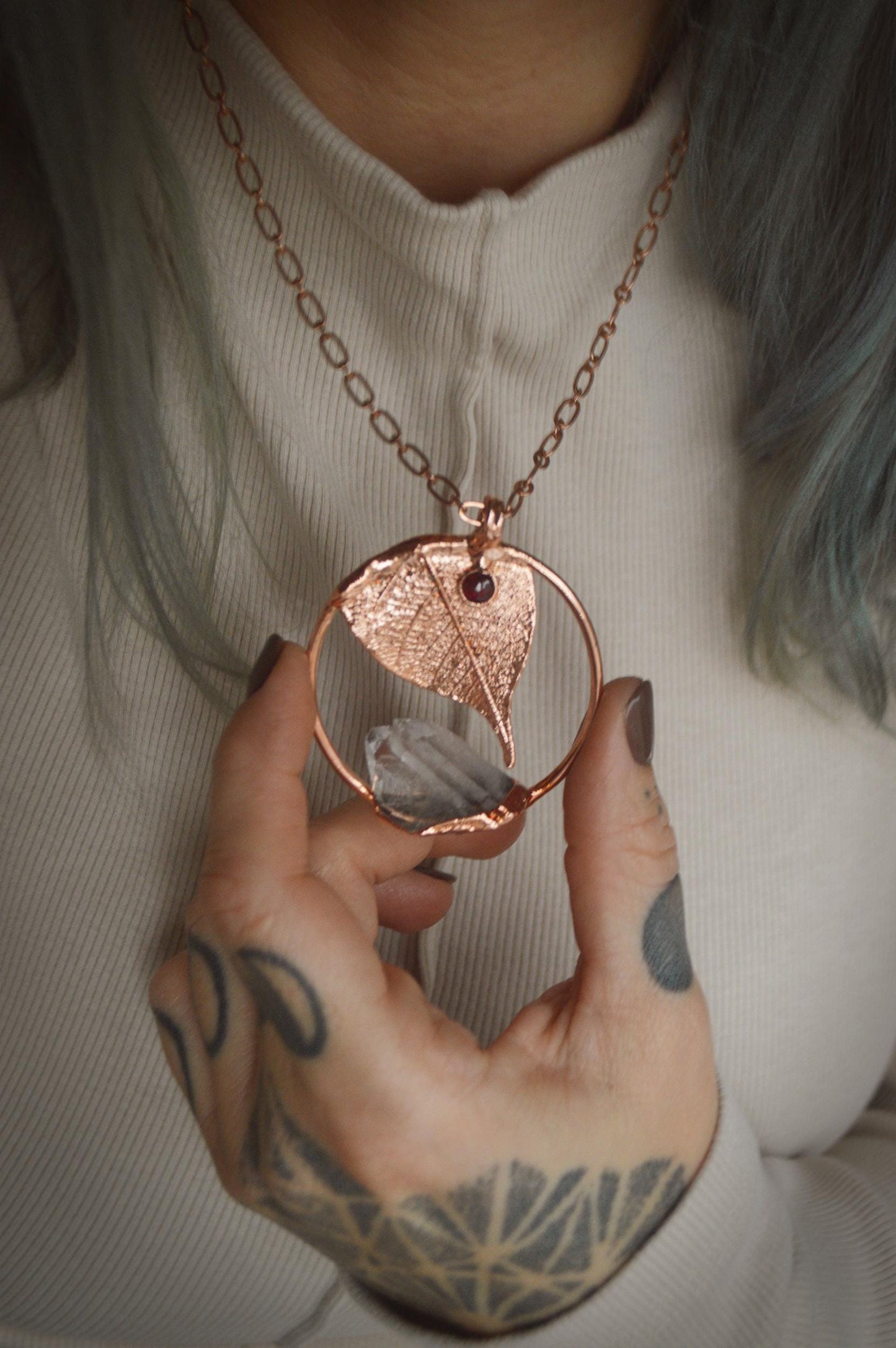 Unique piece. Skeleton leaf formed in copper. Botanical pendant with raw quartz and garnet