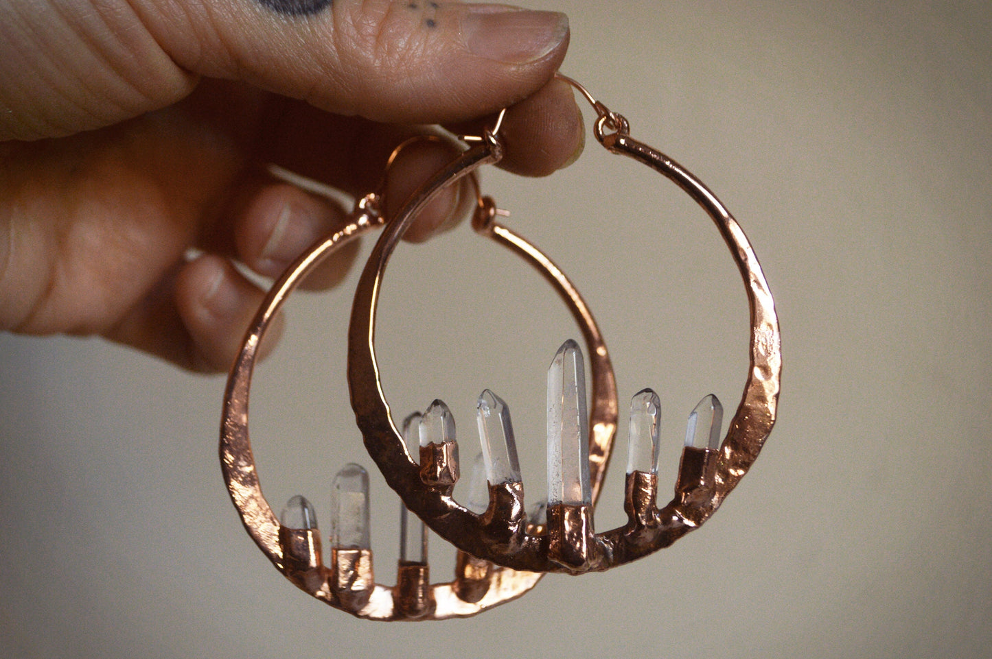 Oversized hammered hoops with quartz points. Electroformed rustic jewellery