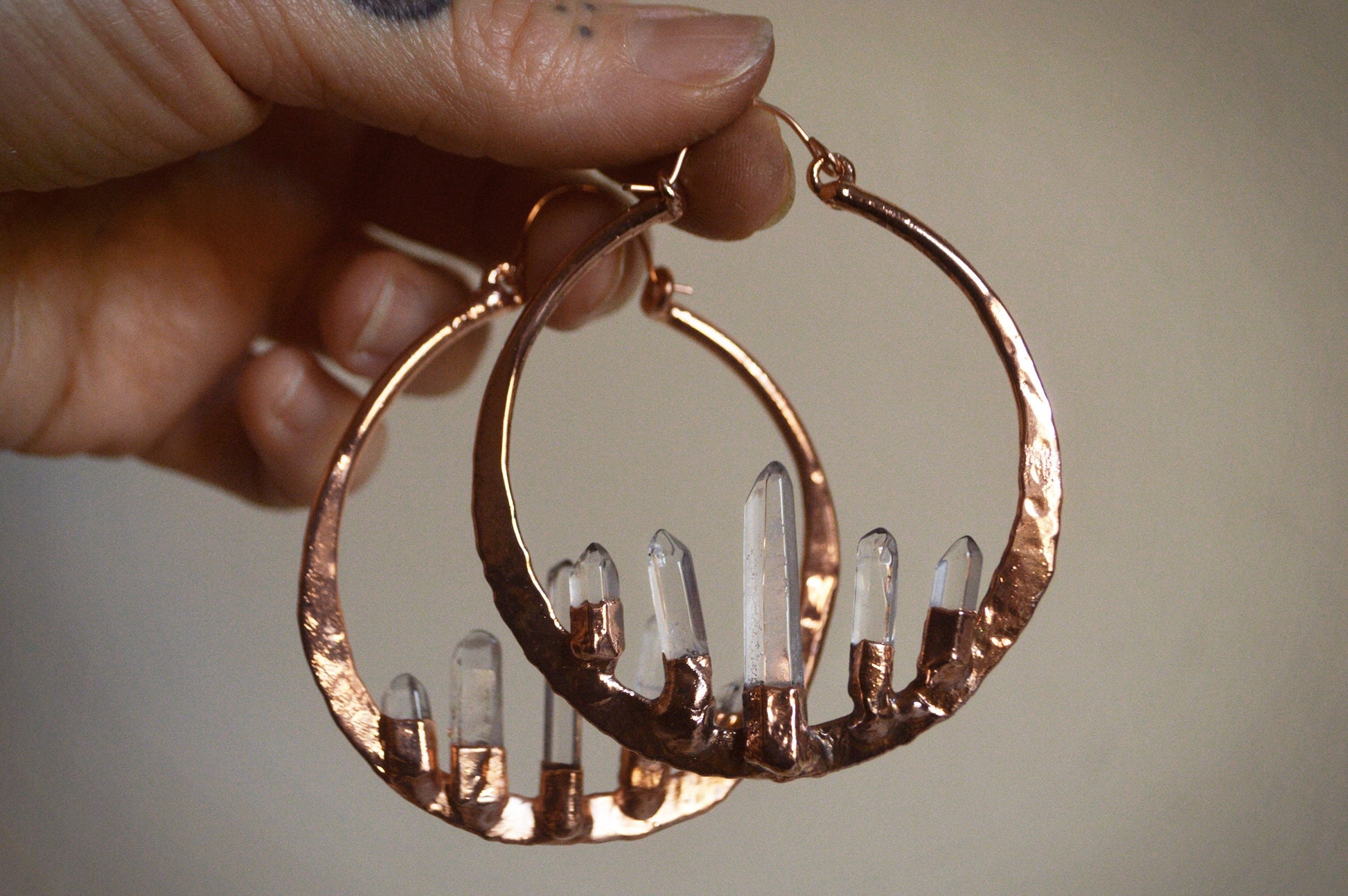 Oversized hammered hoops with quartz points. Electroformed rustic jewellery