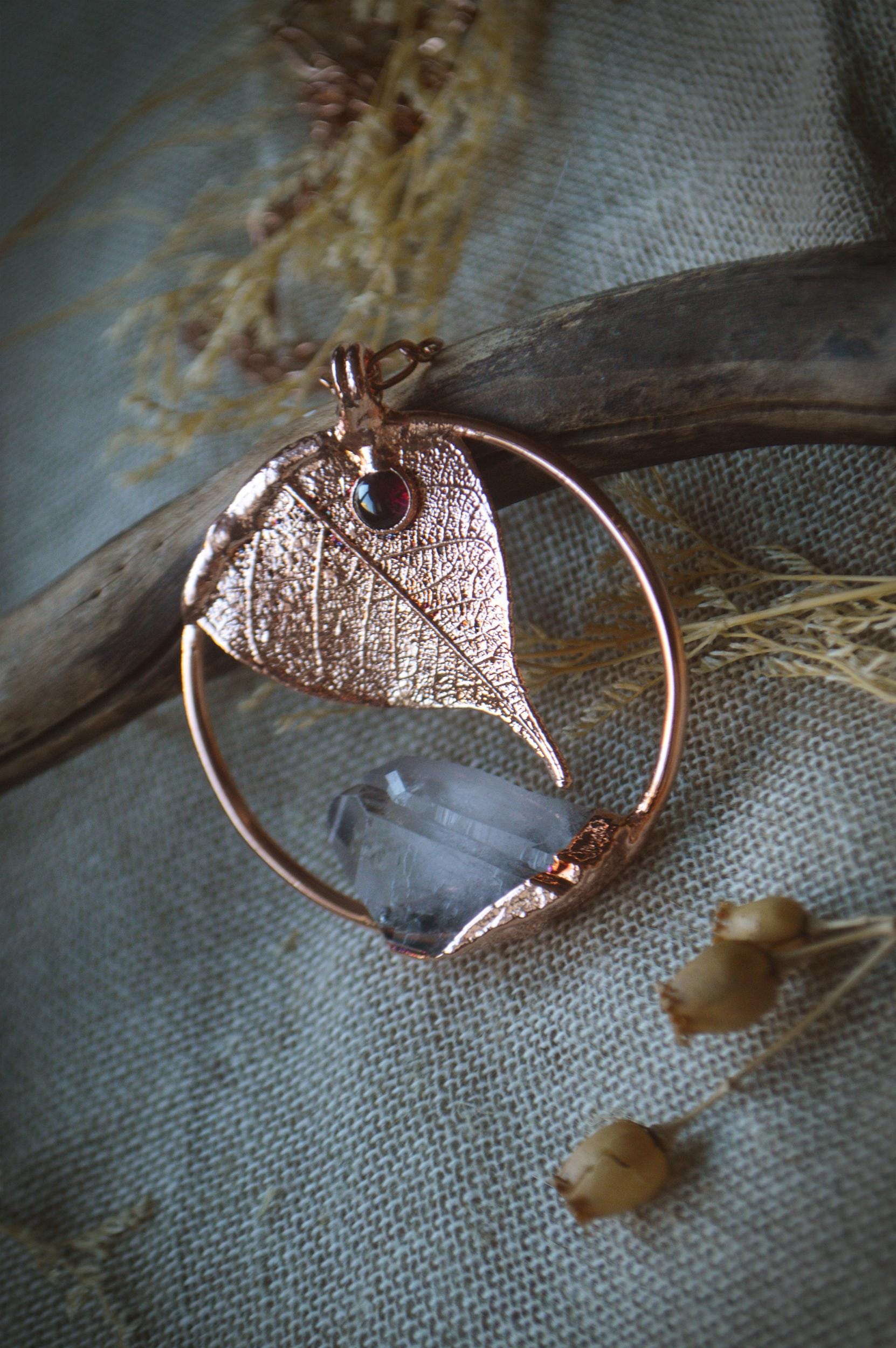 Unique piece. Skeleton leaf formed in copper. Botanical pendant with raw quartz and garnet