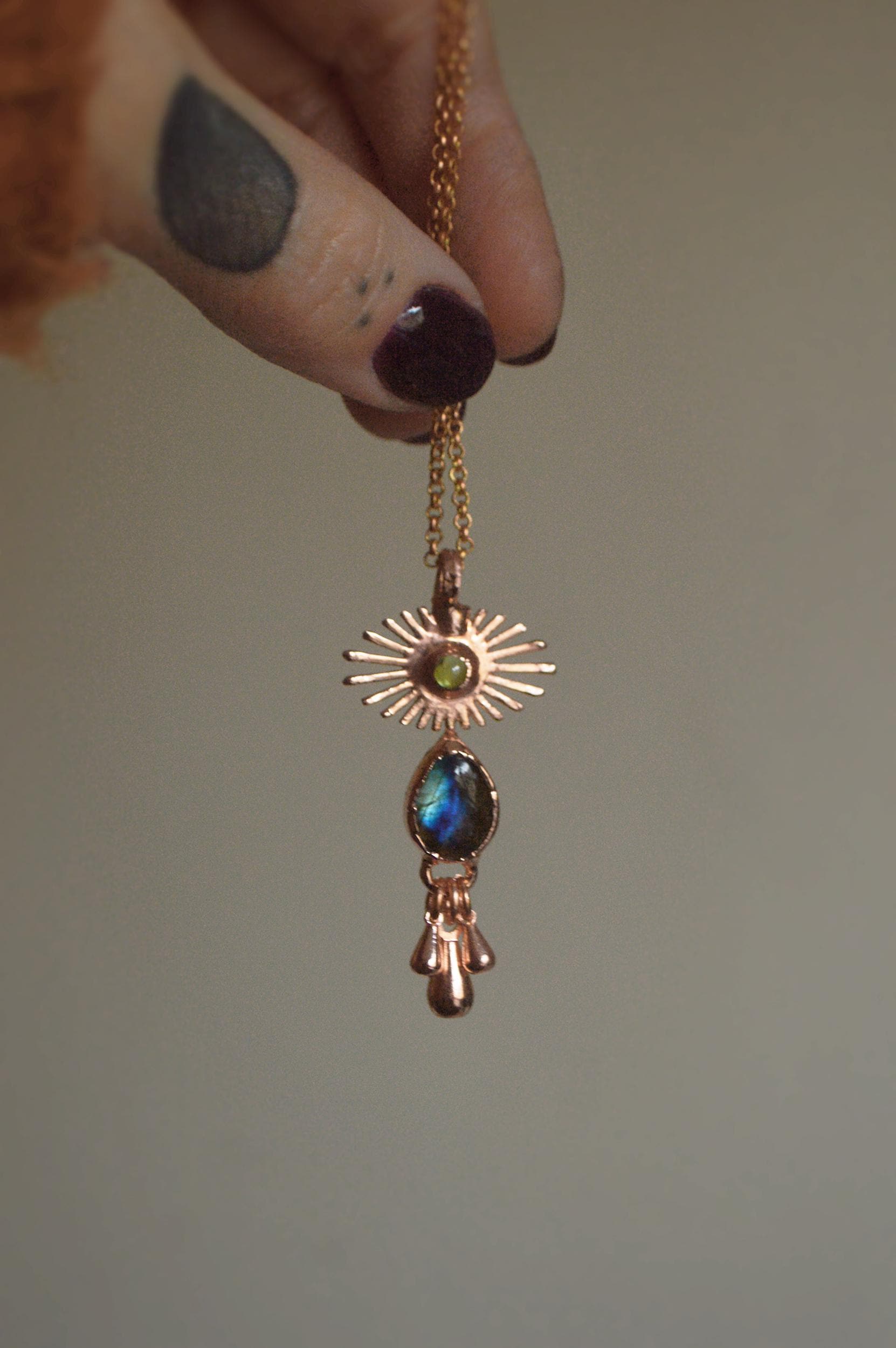 Crying eye pendant with labradorite and peridot. Fringe tassel jewellery
