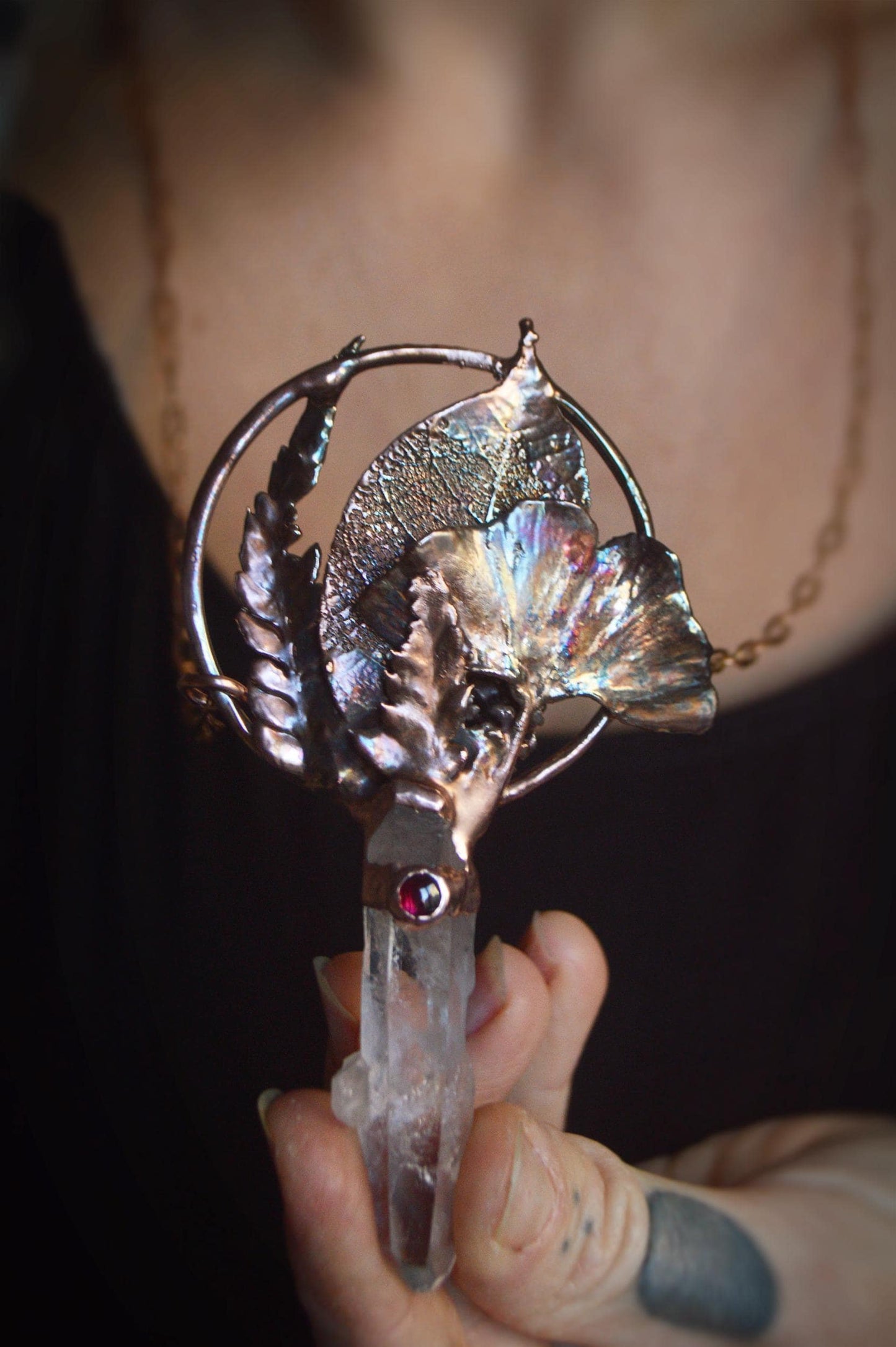 Real leaves bouquet formed in copper. Botanical pendant with raw quartz and garnet