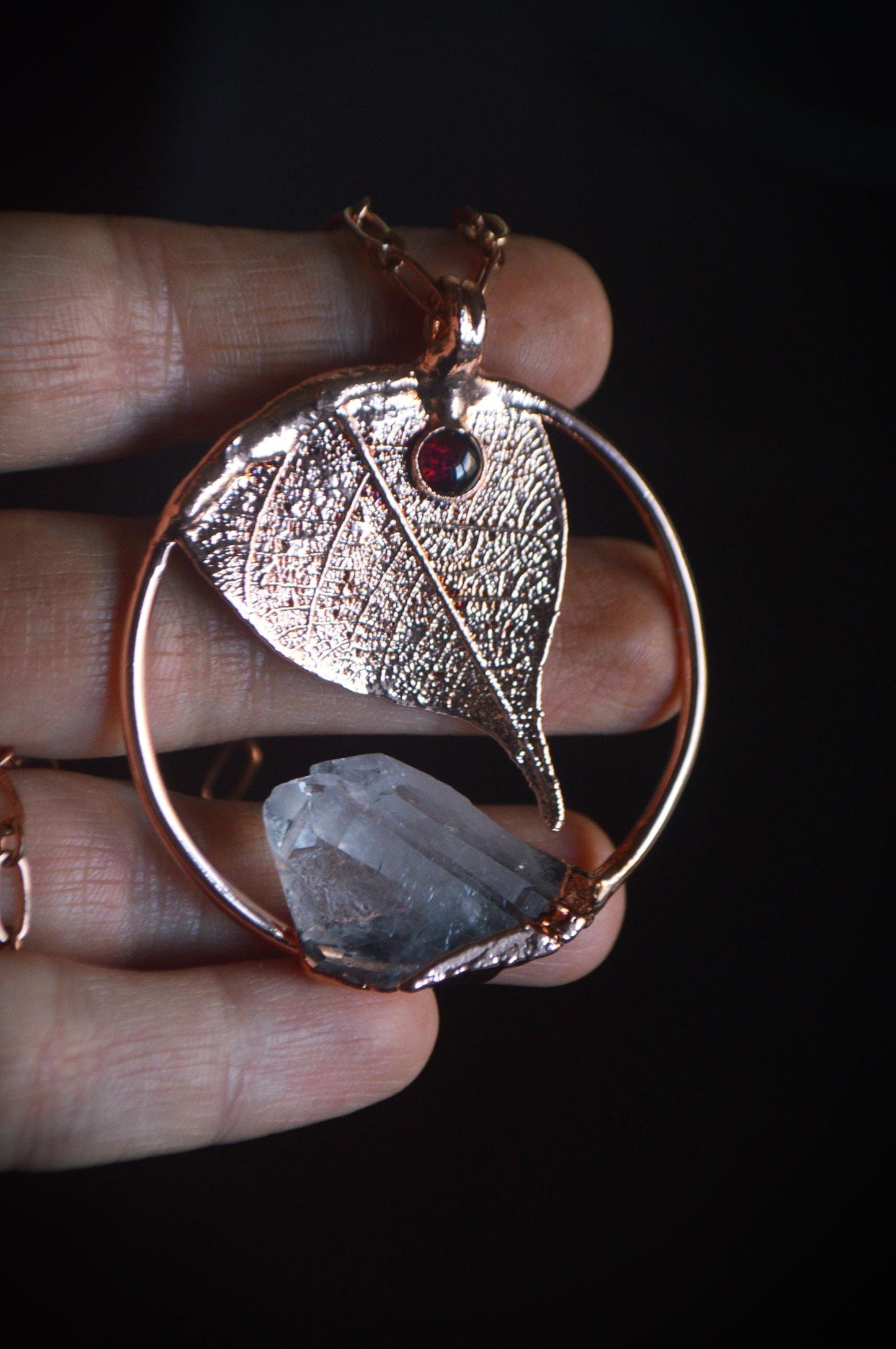 Unique piece. Skeleton leaf formed in copper. Botanical pendant with raw quartz and garnet
