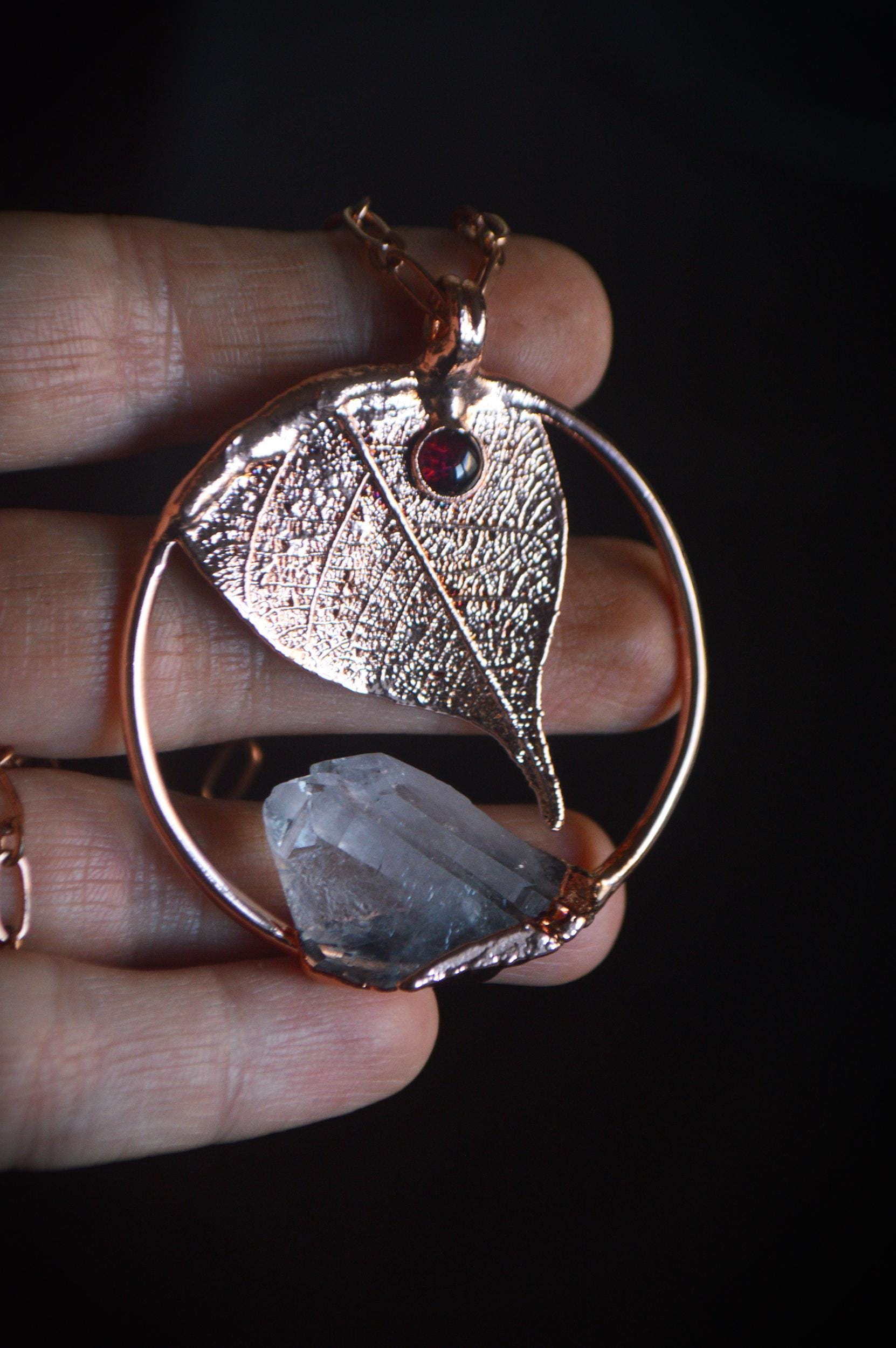 Unique piece. Skeleton leaf formed in copper. Botanical pendant with raw quartz and garnet