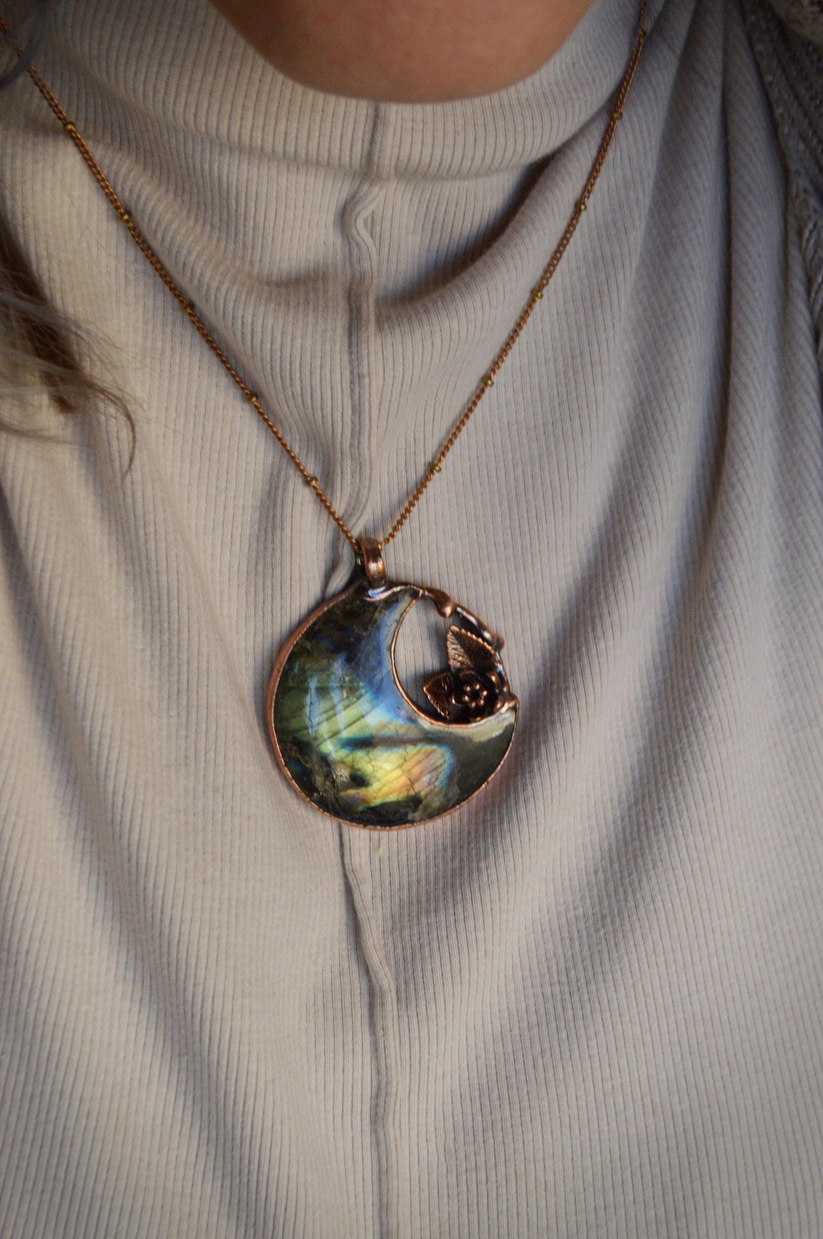 Fantasy pendant with big labradorite moon and miniature flower and leaves
