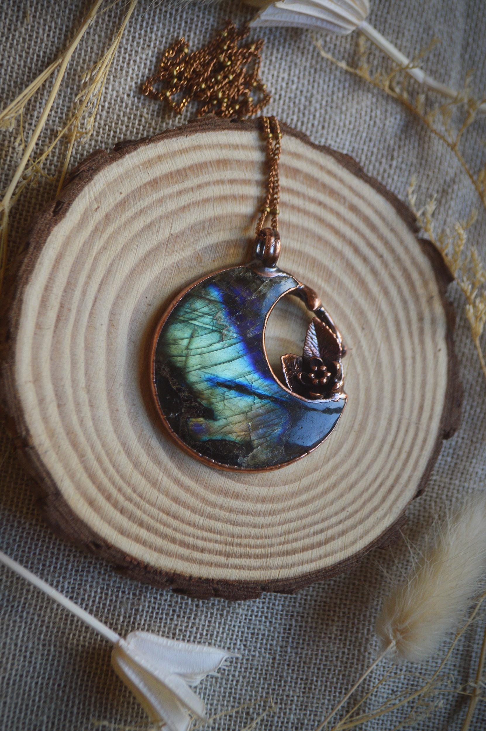 Fantasy pendant with big labradorite moon and miniature flower and leaves