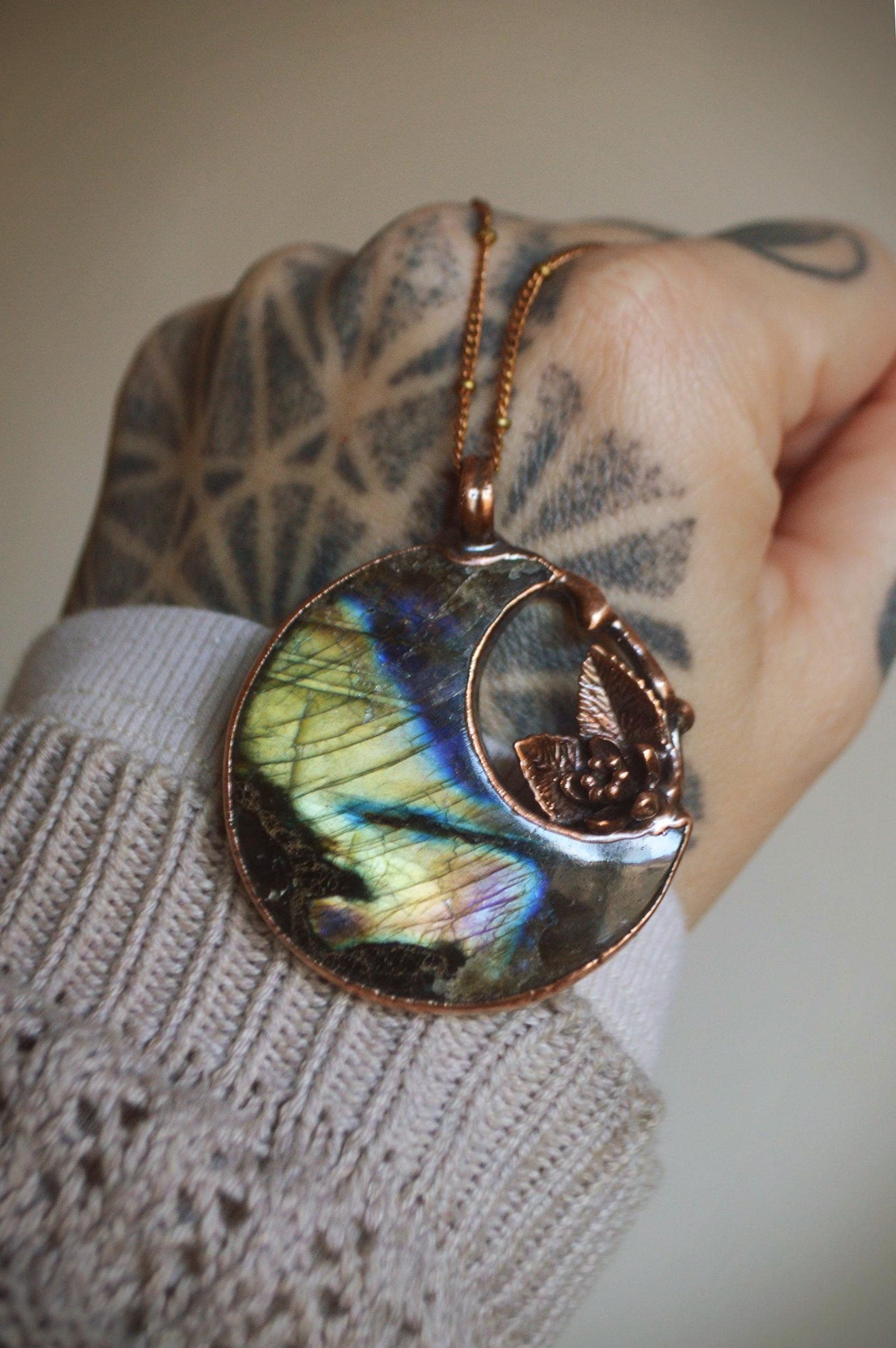 Fantasy pendant with big labradorite moon and miniature flower and leaves