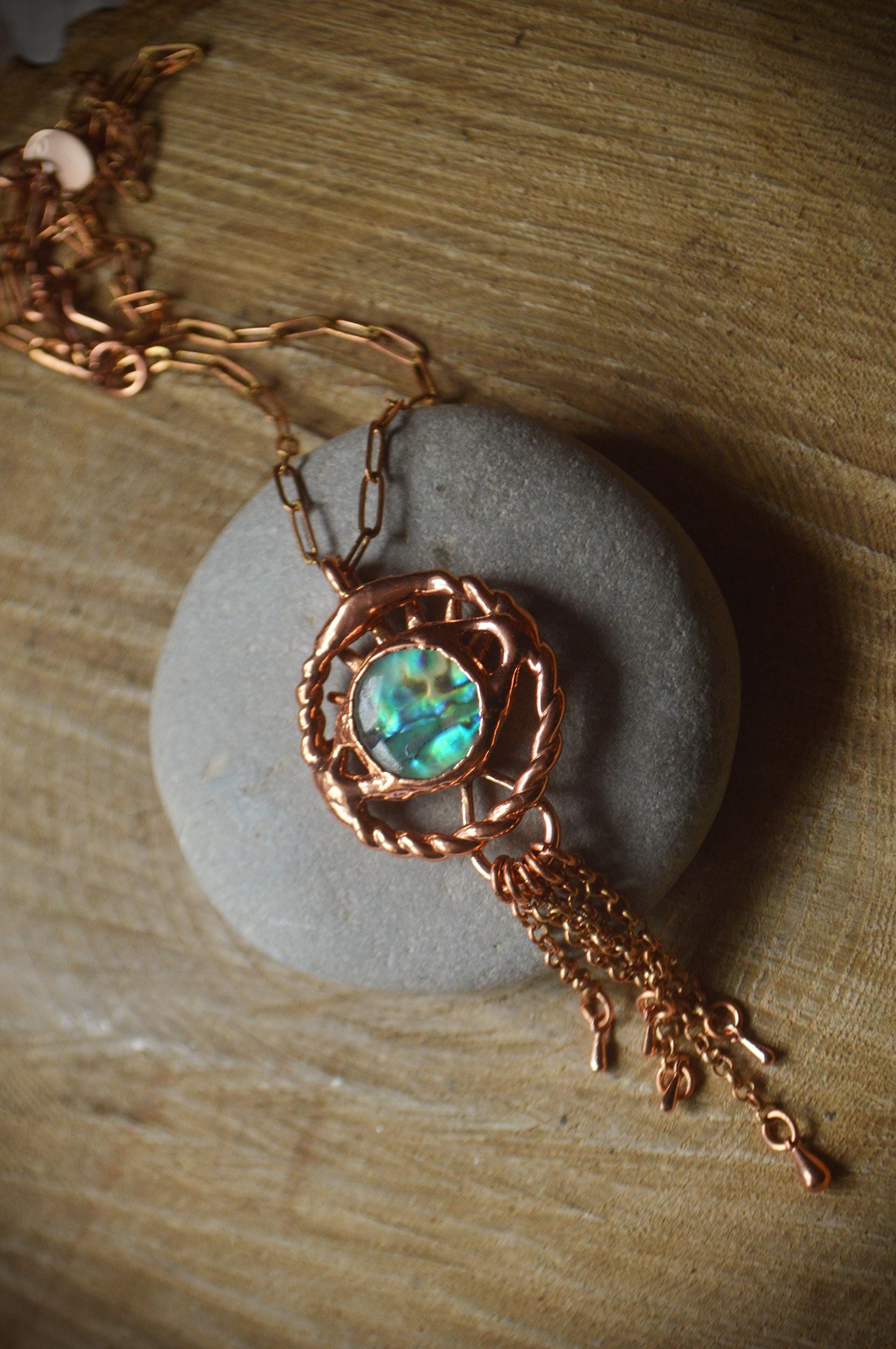 Fringe eye charm necklace with abalone shell.
