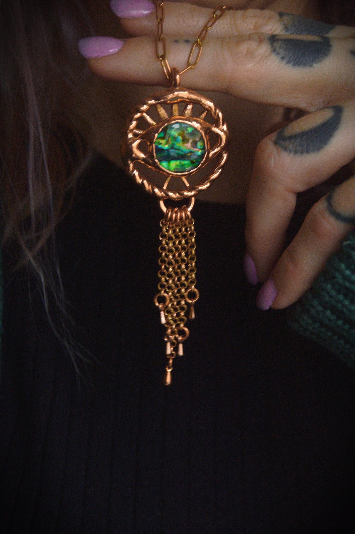 Fringe eye charm necklace with abalone shell.