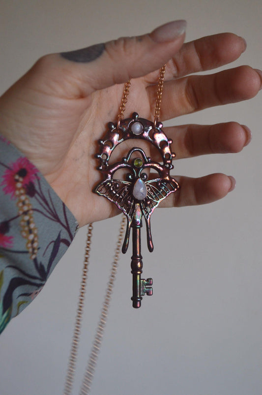 Magical key pendant with moonstone and peridot, whimsical jewellery