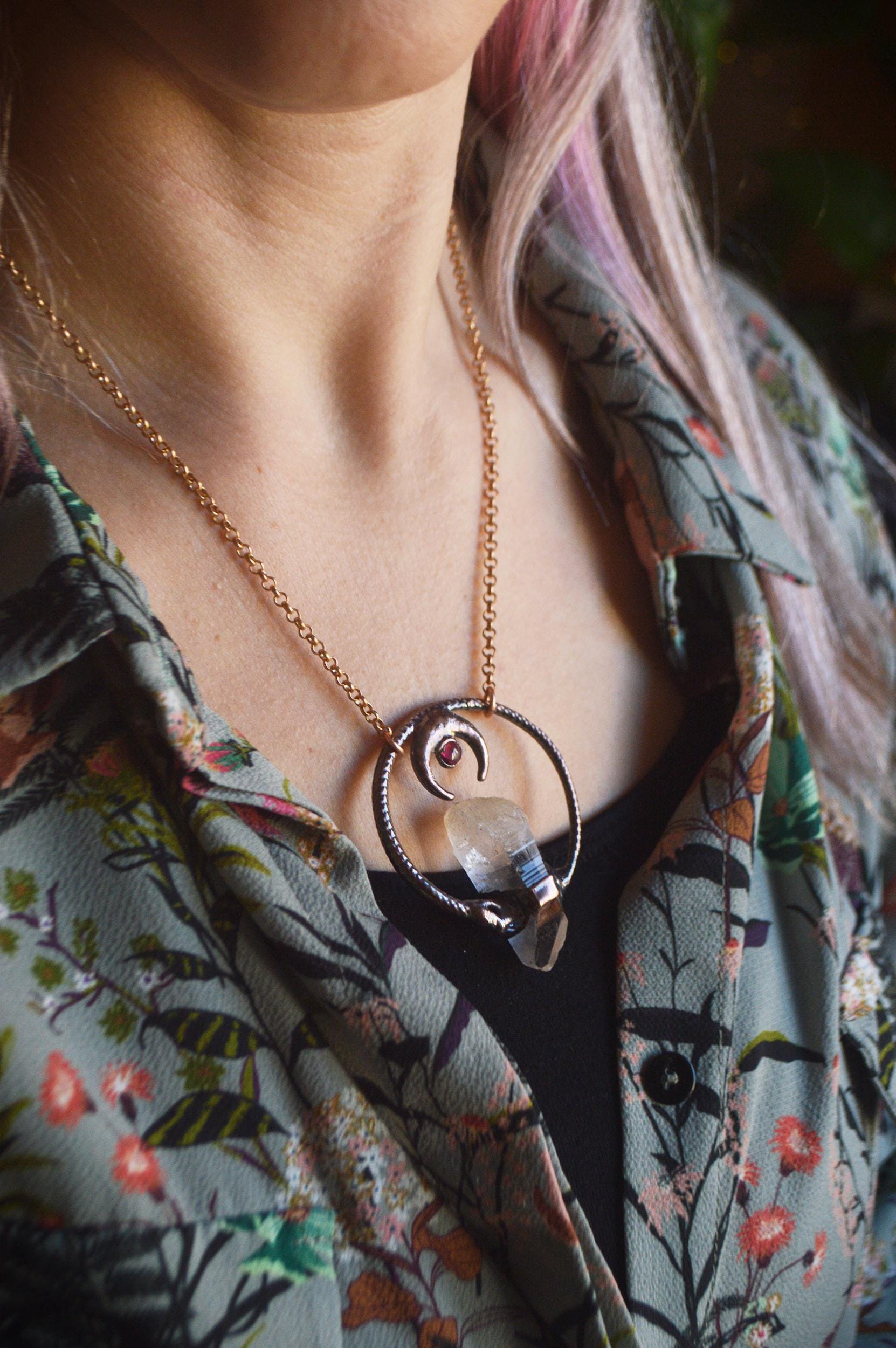 Ouroboros garnet and quartz point pendant necklace