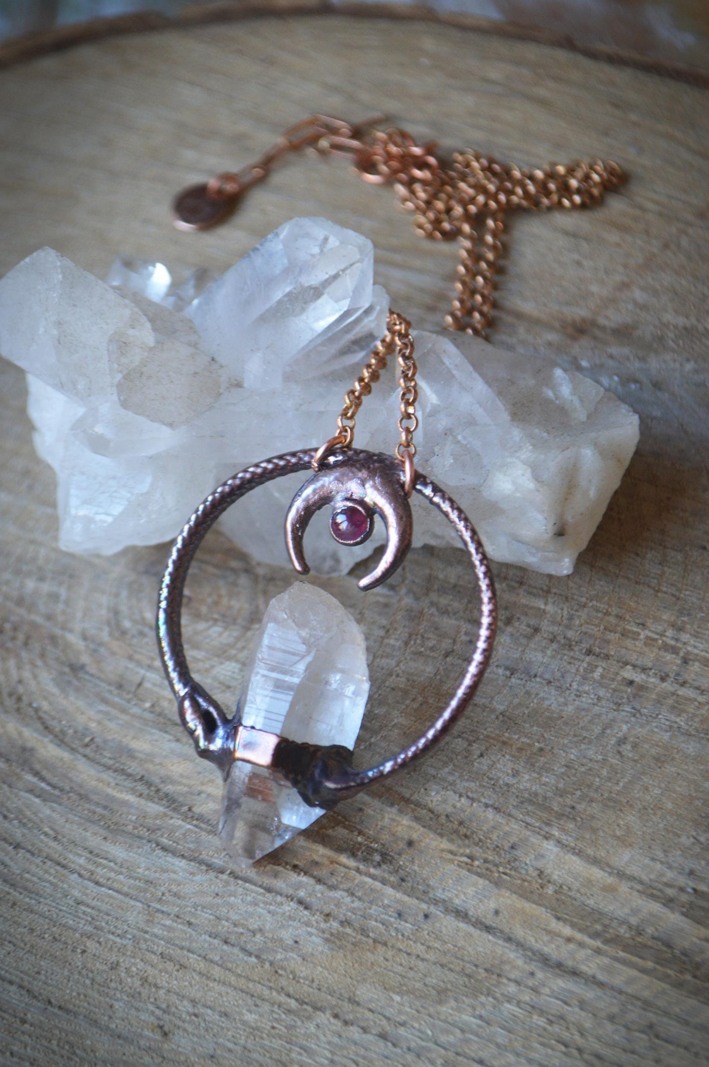Ouroboros garnet and quartz point pendant necklace