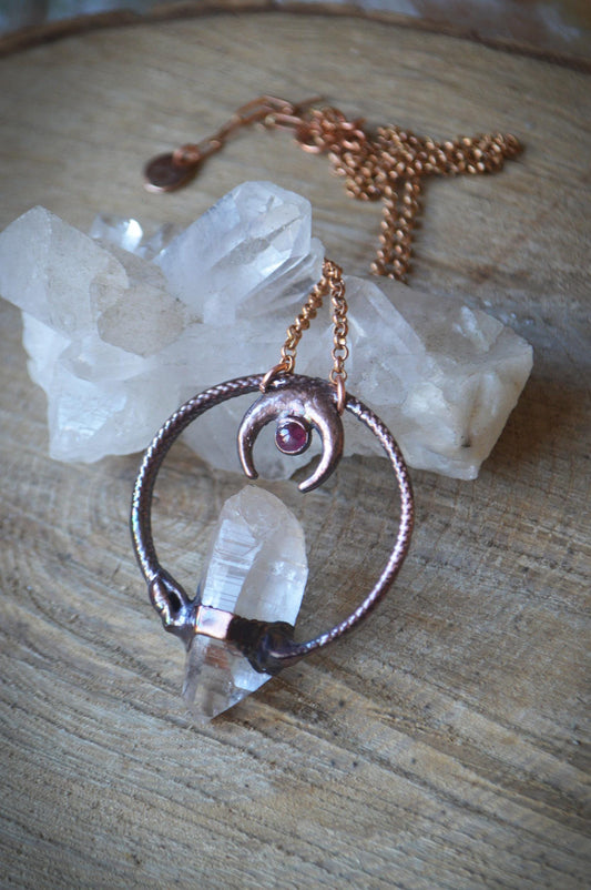 Ouroboros garnet and quartz point pendant necklace