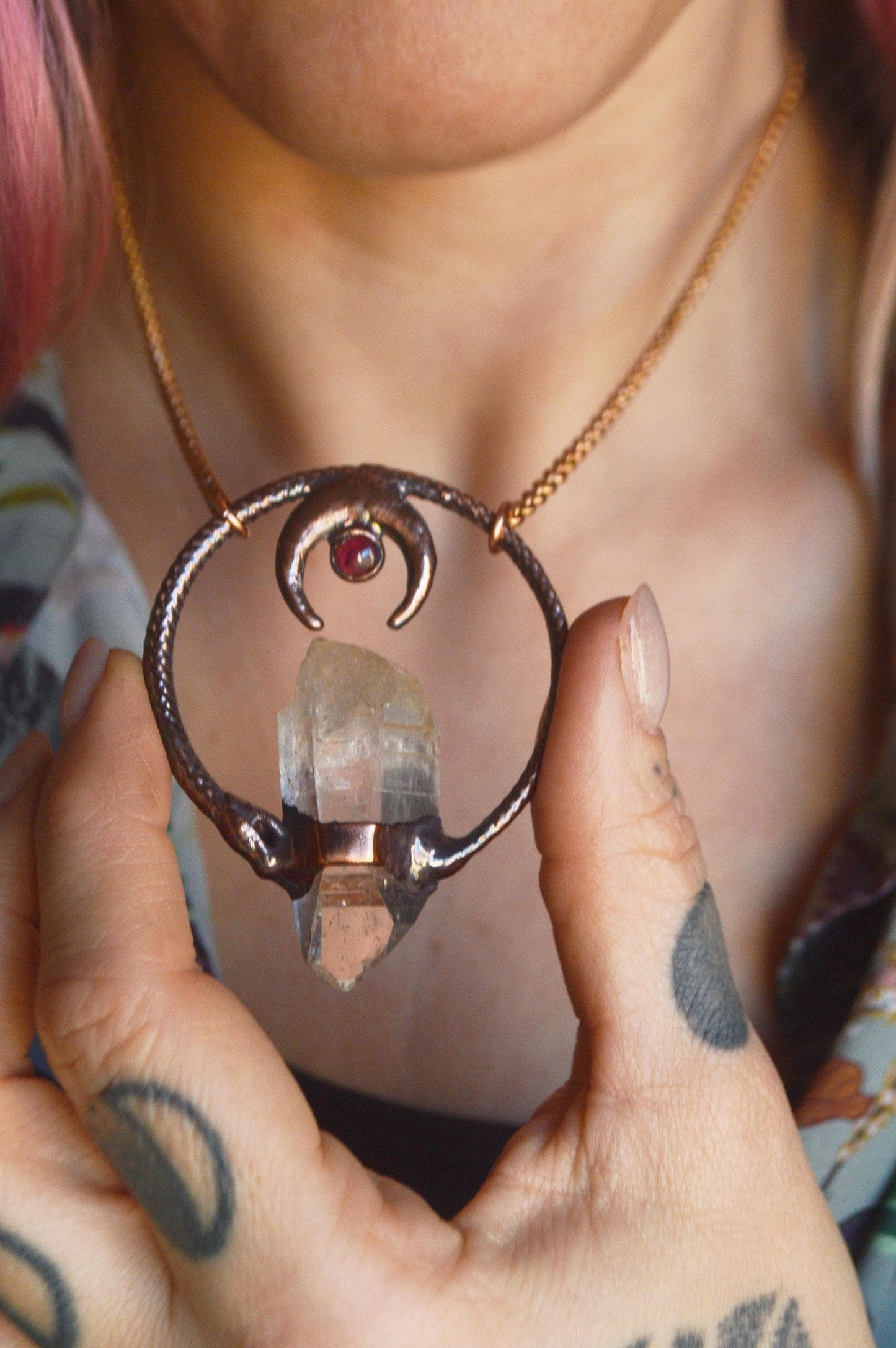 Ouroboros garnet and quartz point pendant necklace