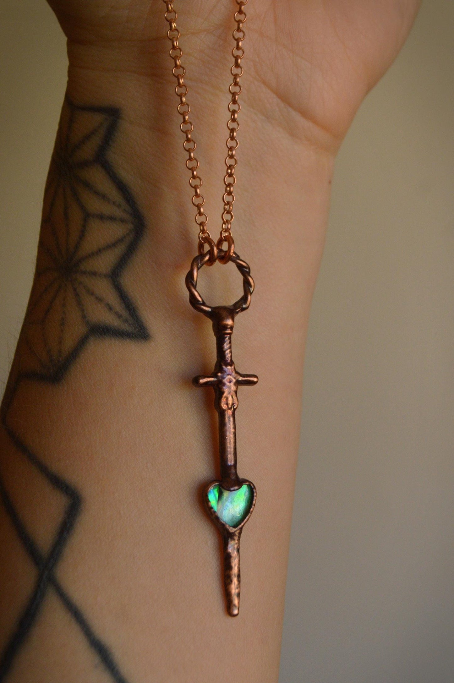 Heart and dagger necklace with abalone shell. Romantic goth pendant