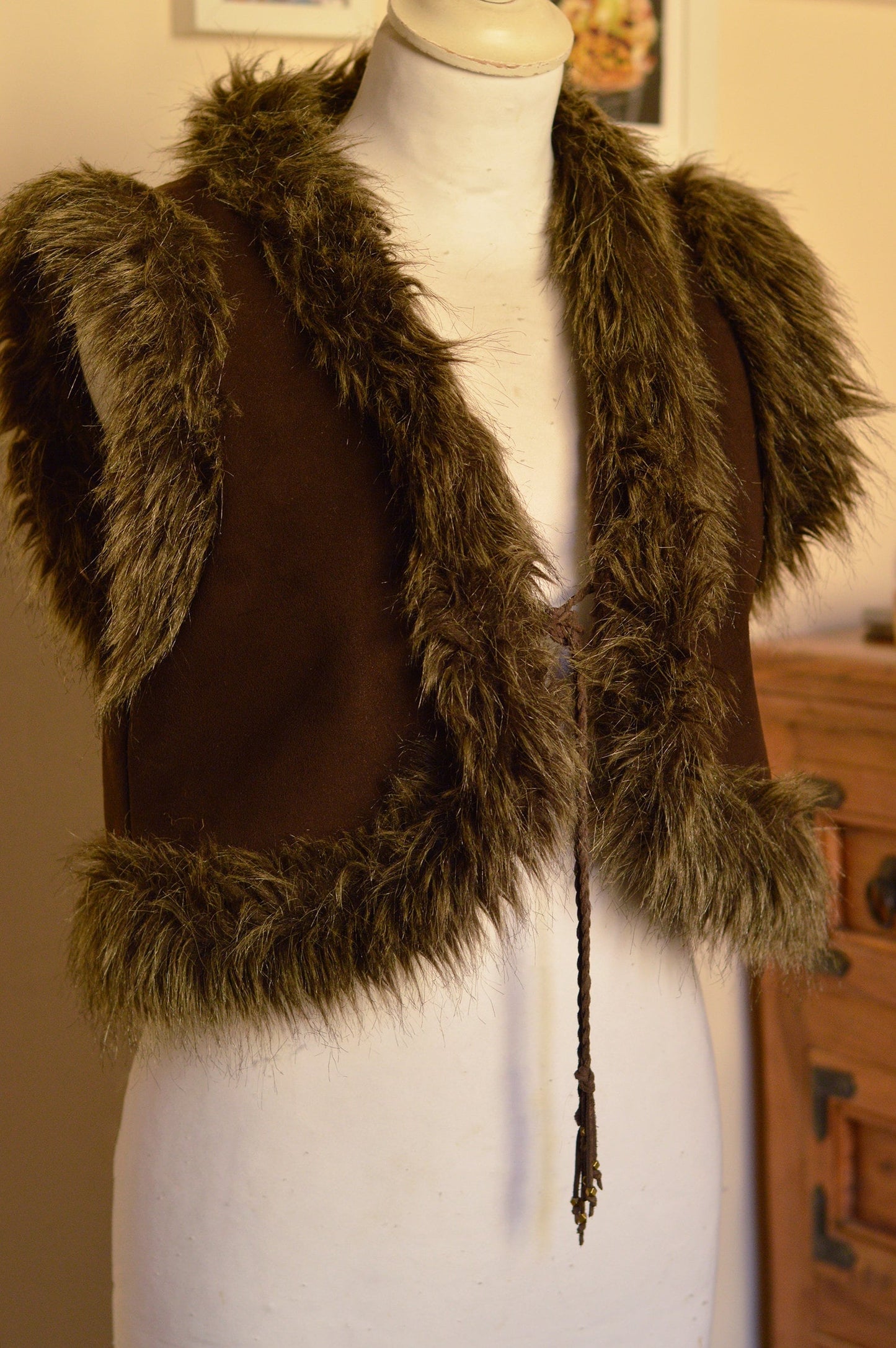 Faux fur cropped waistcoat. Hand printed, embellished brown jacket