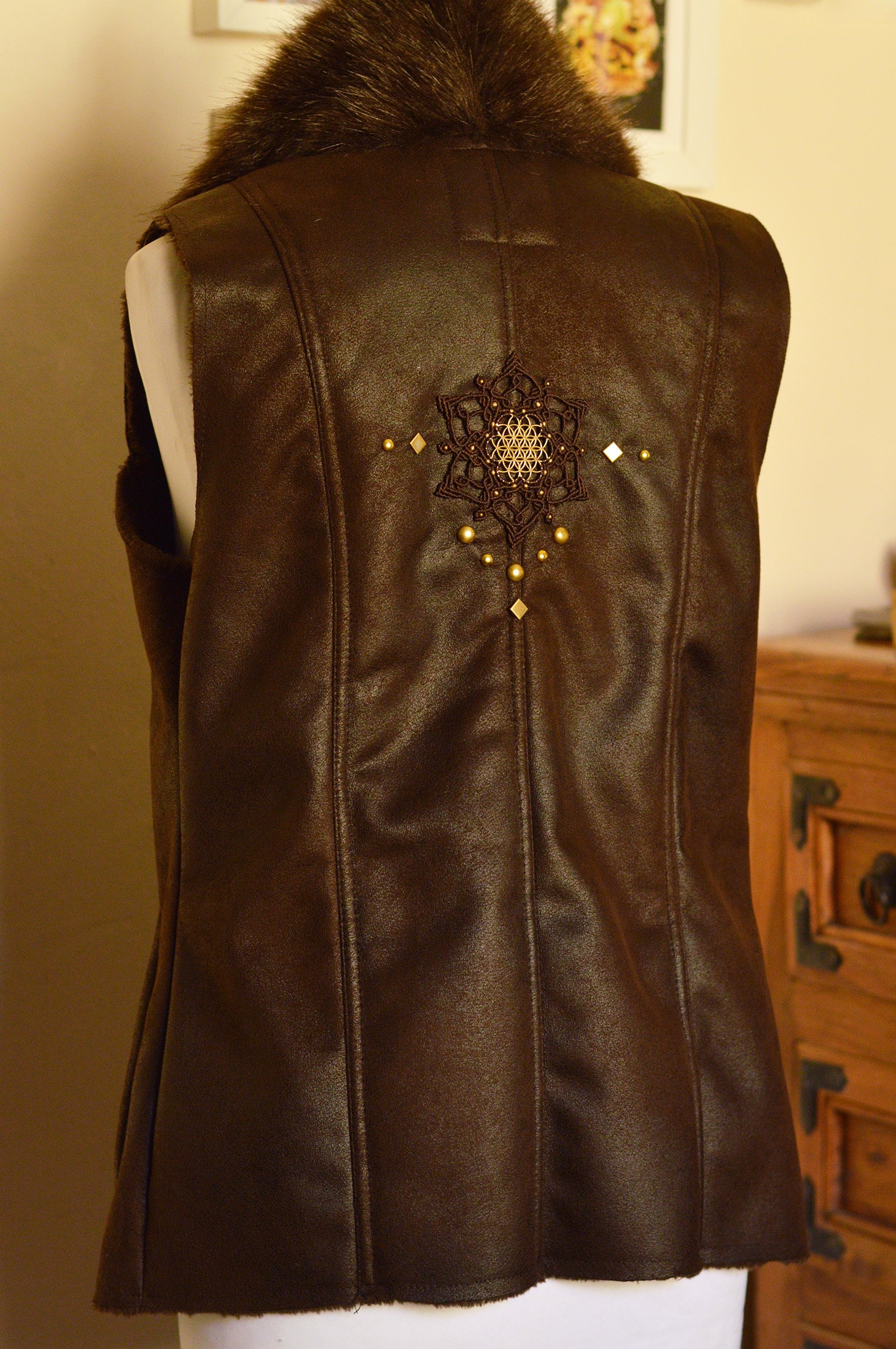 Dark brown faux fur waistcoat. Flower of life macramé applique. Sacred geometry festival clothing